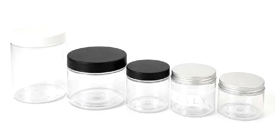 Five empty single-serve gelato cups lined up by size, with tamper-proof black, white and aluminium lids